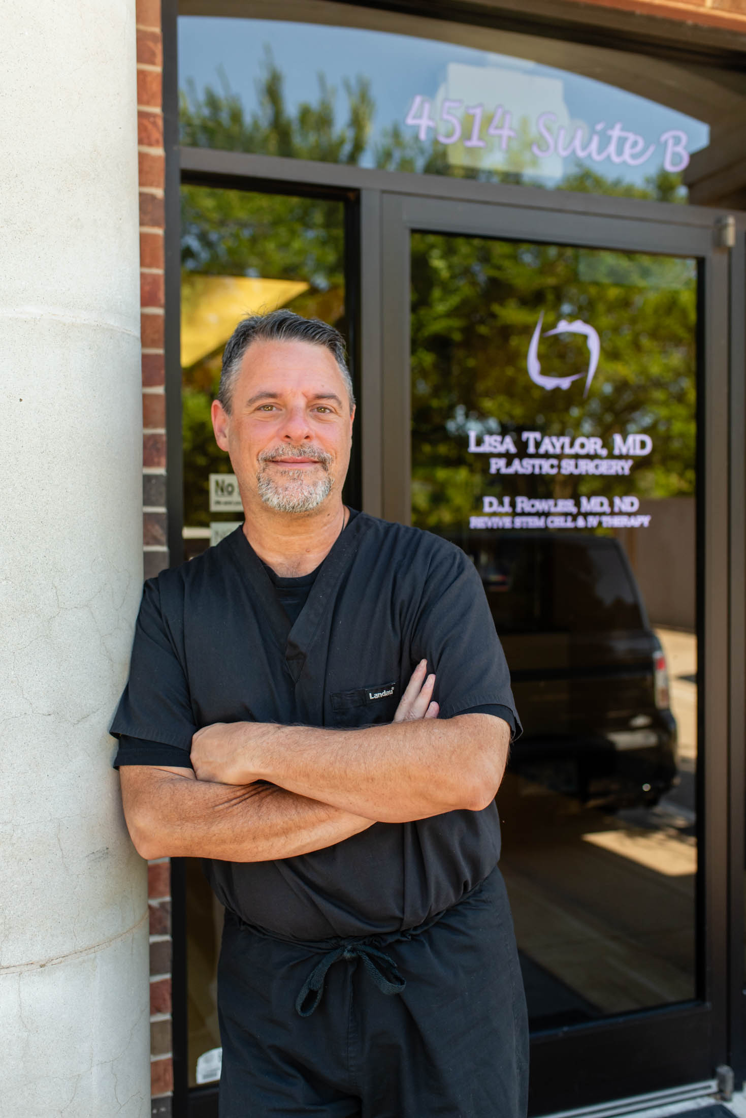 Man standing outside a medical office building.